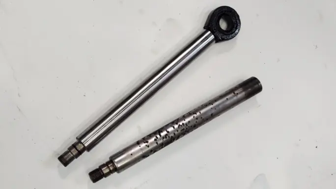 Hydraulic equipment components undergoing inspection and refurbishment